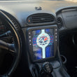 Load image into Gallery viewer, Corvette dashboard with a tesla style screen showing corvette logo
