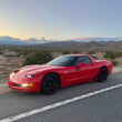 Load image into Gallery viewer, C5 corvette in the desert with sleepy eye headlights from knightdrivetv with bezels
